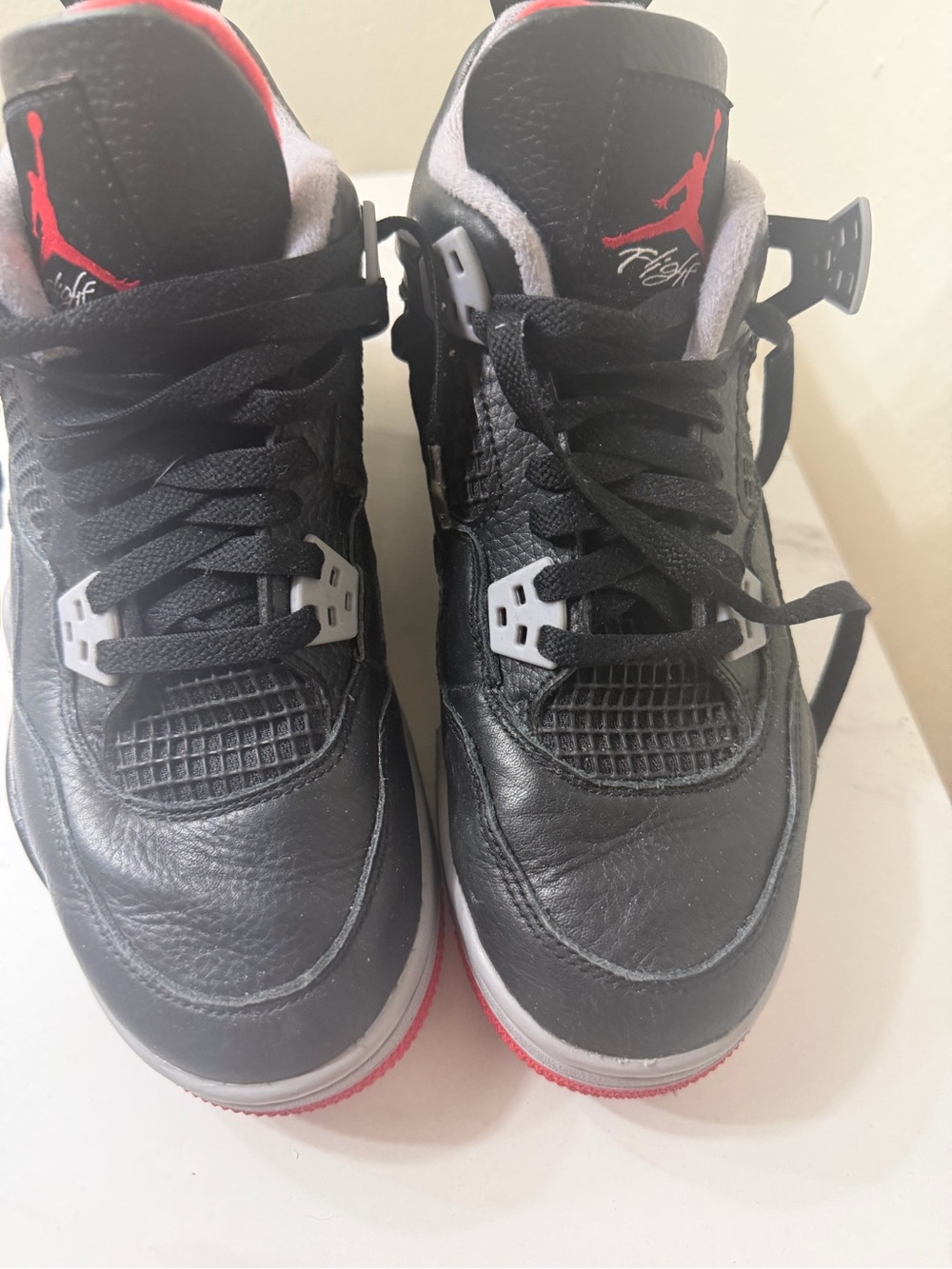 Nike Black and Red Air Jordan 4 Retro Sneakers